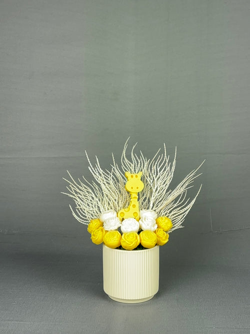 Gigi Giraffe yellow and white candle bouquet with giraffe centerpiece in ribbed cream ceramic vase