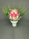 Tulip Garden Pink tulip candle bouquet with pink and white tulips, green leaves and white fillers in a white ribbed ceramic pot