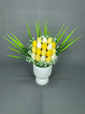 Tulip Garden Yellow tulip candle bouquet with yellow and white tulips, green leaves and white fillers in a white ribbed ceramic pot